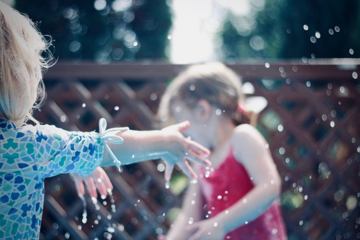 little-girls-playing-in-water